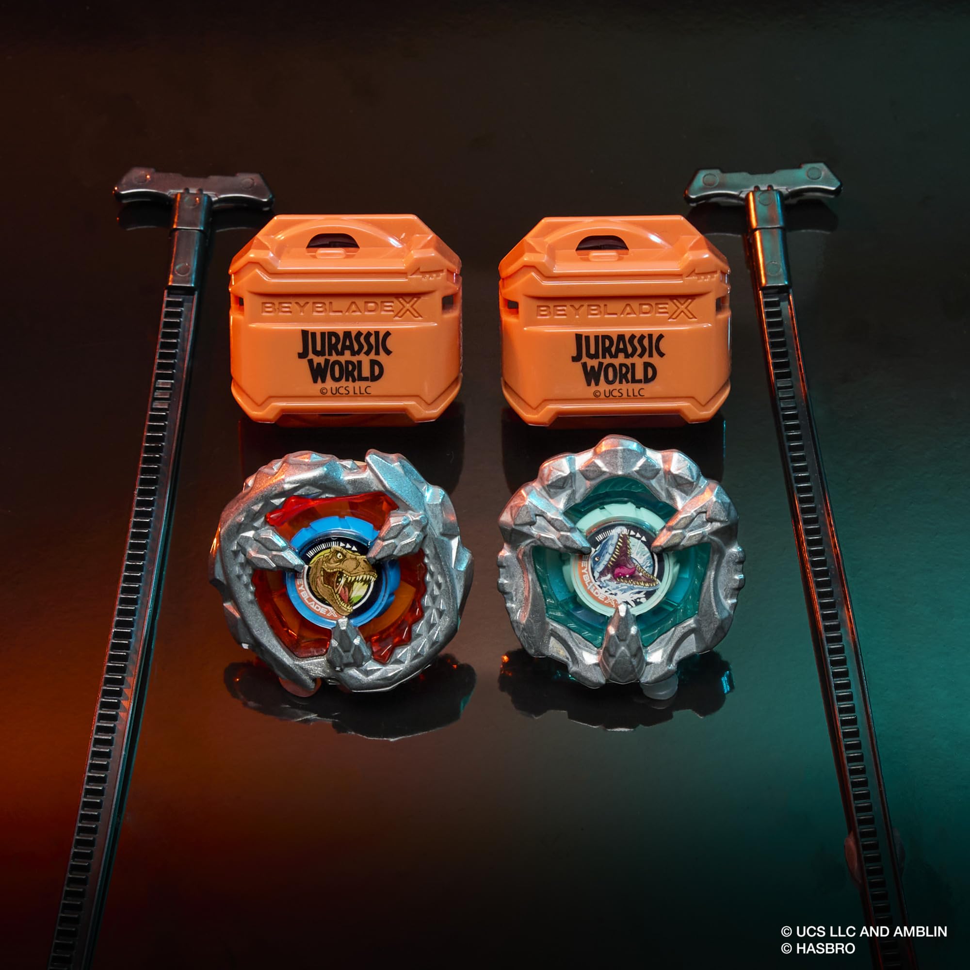 Beyblade X Beystadium battle scene featuring Jurassic World collab tops