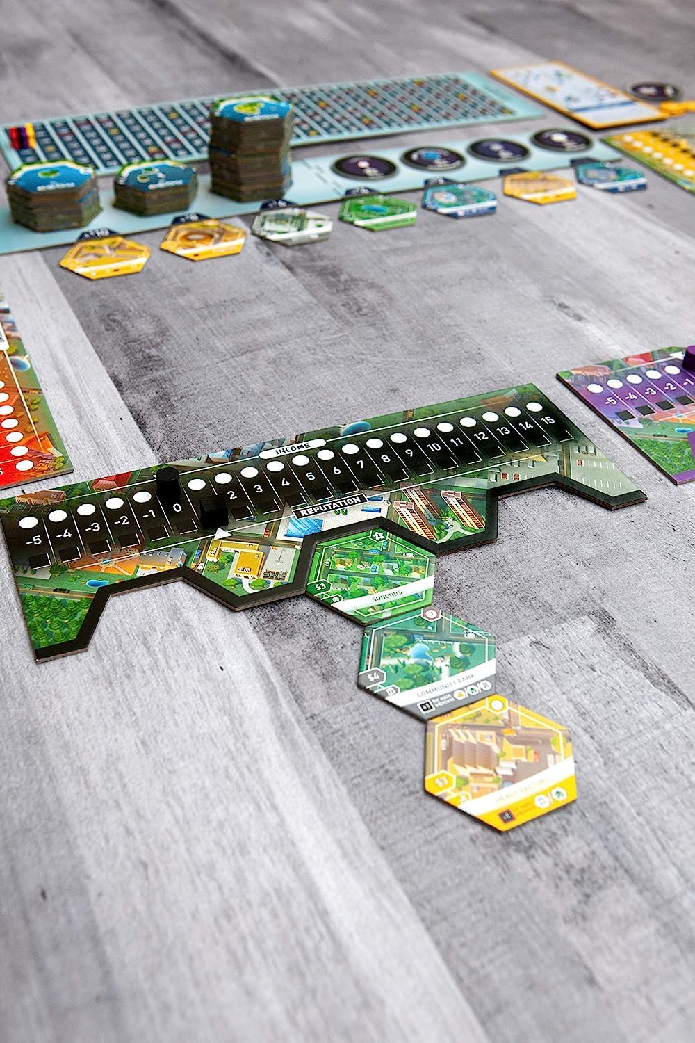 Bezier Games Suburbia special points image featuring landmarks and bonuses