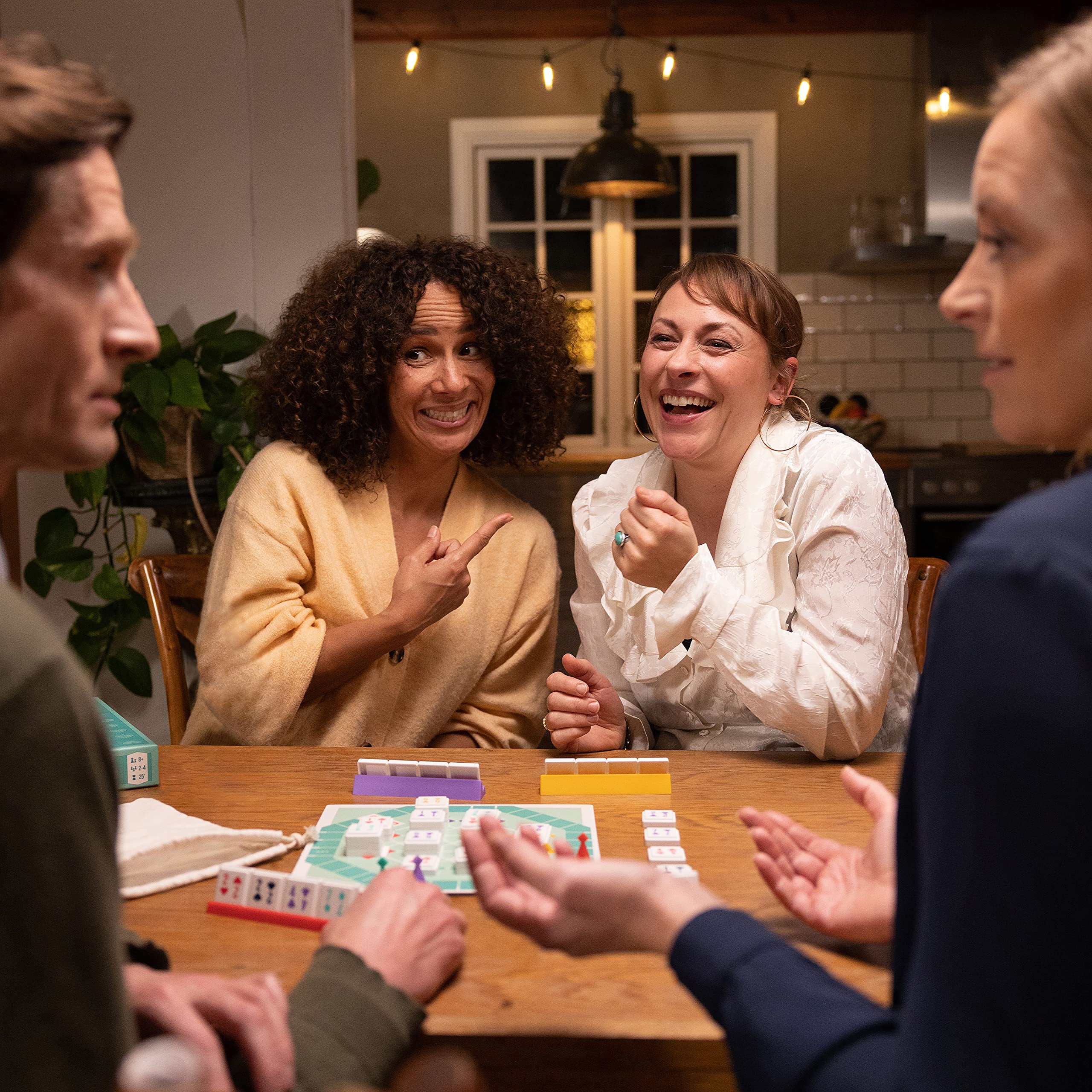 Family enjoying a cozy Bezzerwizzer Setup game night.