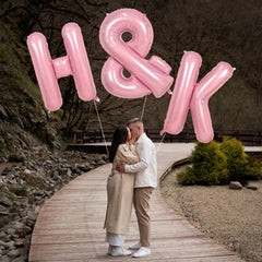 Biapian name-abbreviation balloon in pink suits birthdays and baby showers.