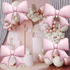 Biapian pink bow balloon with white ribbon included.