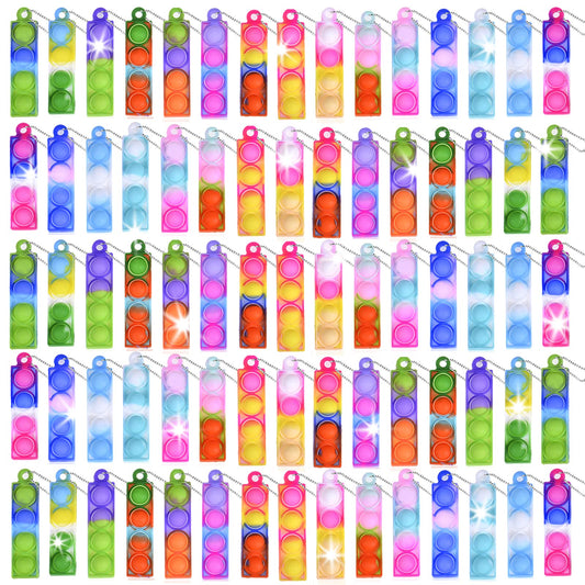 BicMan mini pop keychain set on display, soft silicone for safe play