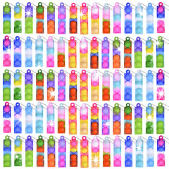 BicMan mini pop keychain set on display, soft silicone for safe play