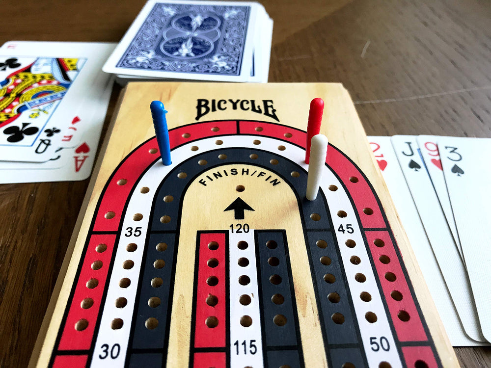 Bicycle 3-Track Cribbage Board with peg storage under the board.
