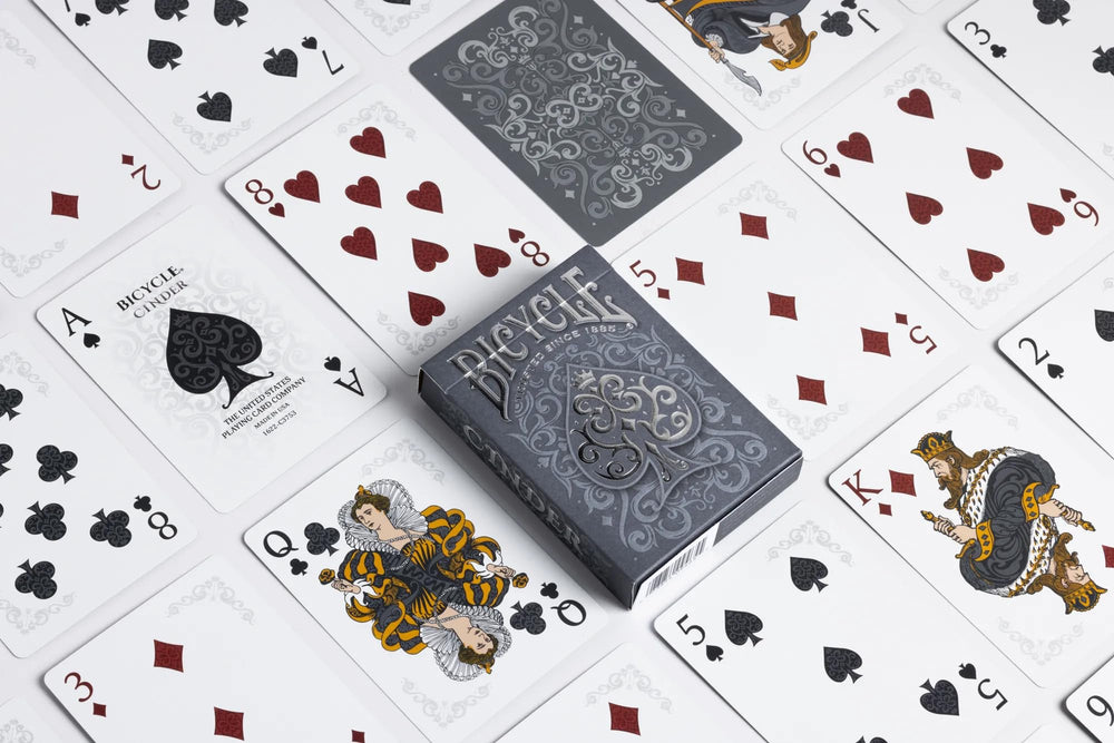 Bicycle Cinder court cards in warm gold evoke glowing embers for play