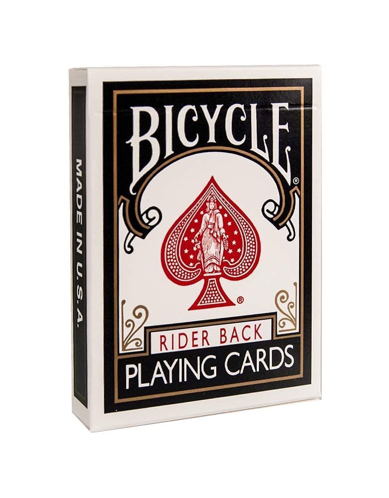 Family game night with Rider Back decks on a wooden table.