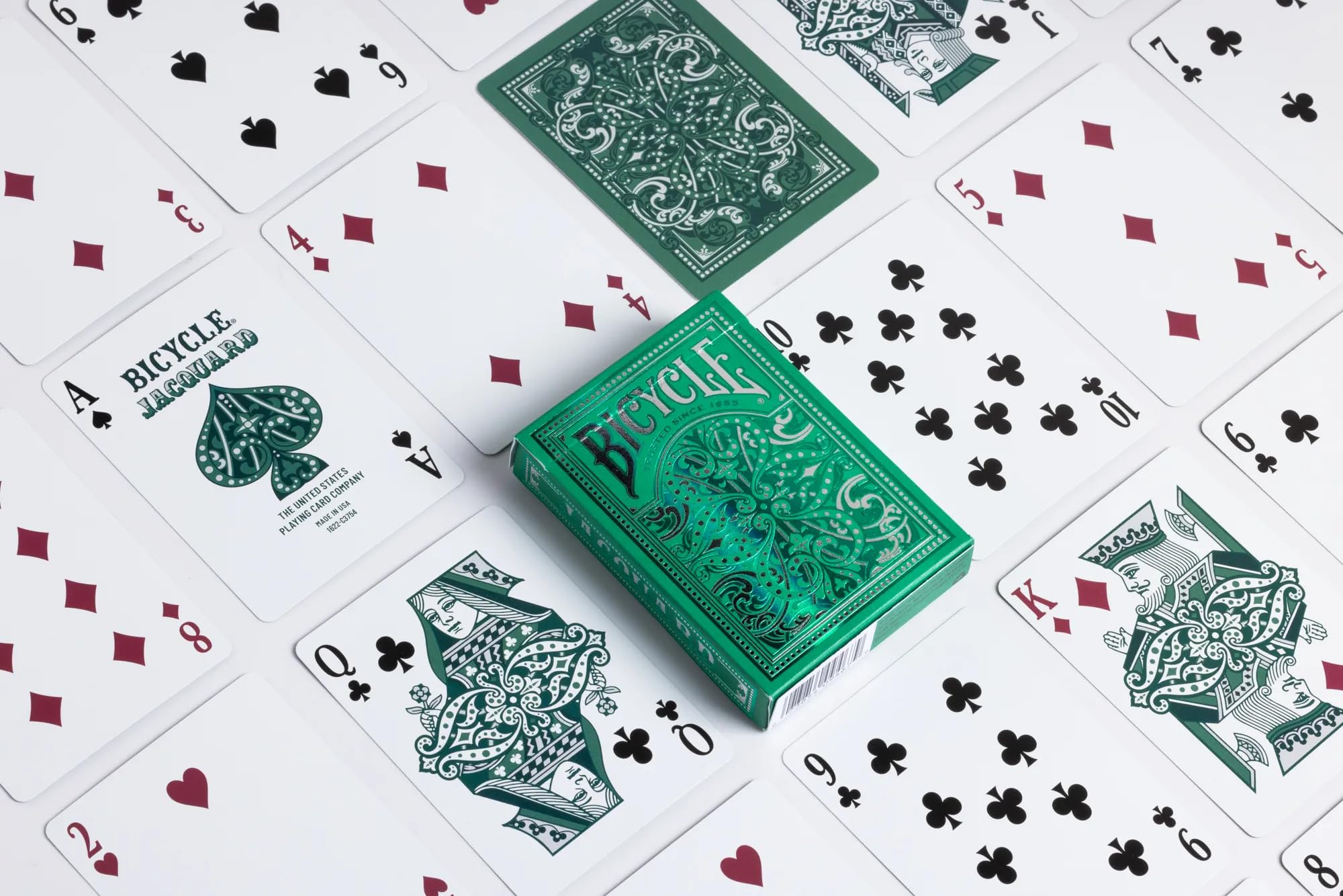 Card backs of Bicycle Jacquard feature woven-inspired design in silver and green