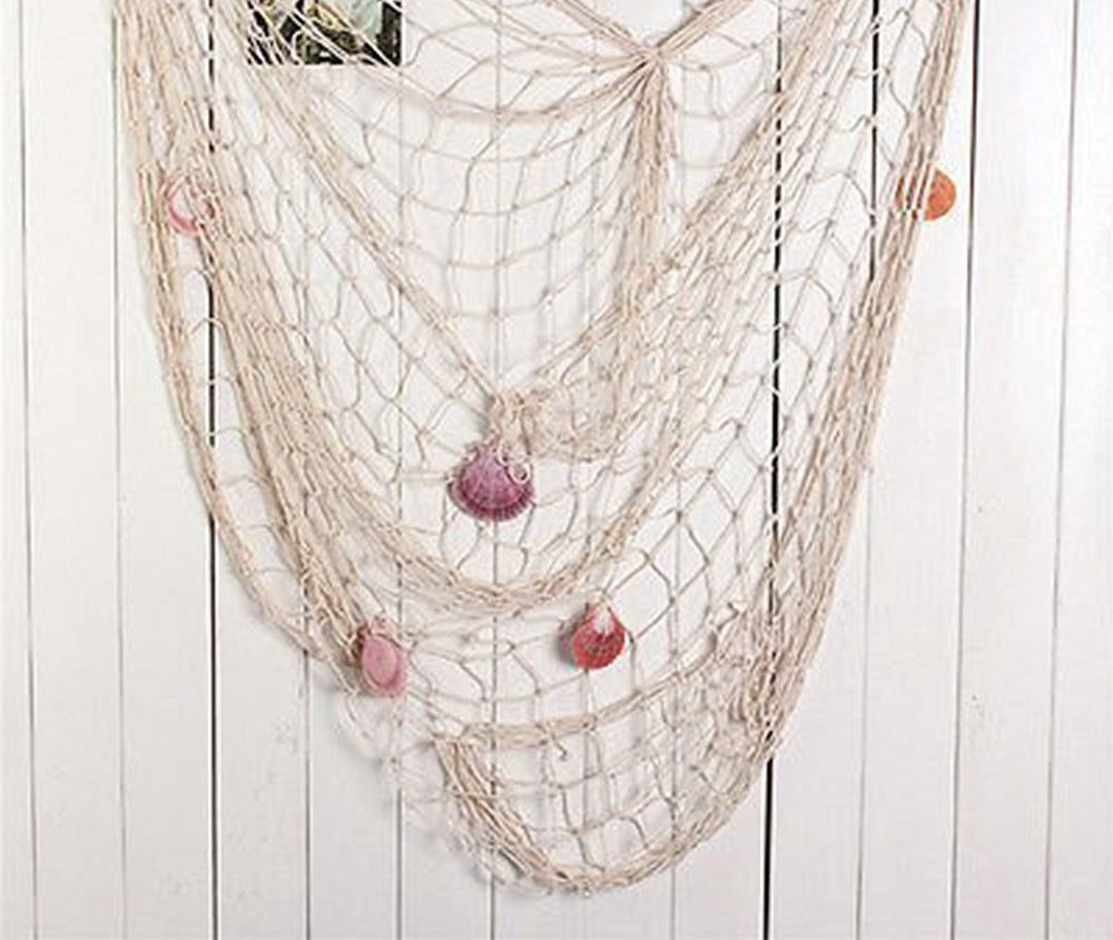 Big Mo's Toys beach party setup gains depth with natural fish net draping.