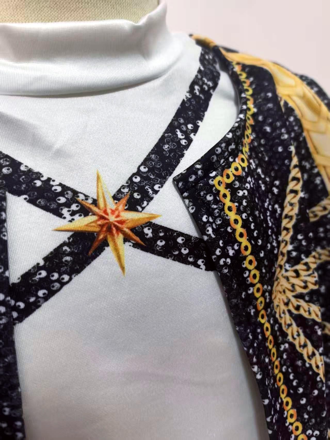 Binbo Rumi golden costume top close-up featuring sequin straps and star detail for chic layering