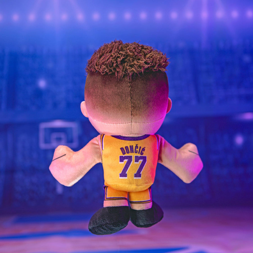 Bleacher Creatures Luka Doncic plush on a display shelf for collection flair.