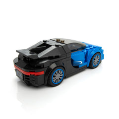 Hands assemble the Block Builder Bugatti model on a table