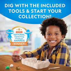 Blue Marble Gemstone Dig Kit magnifying glass inspecting a newly uncovered gem.