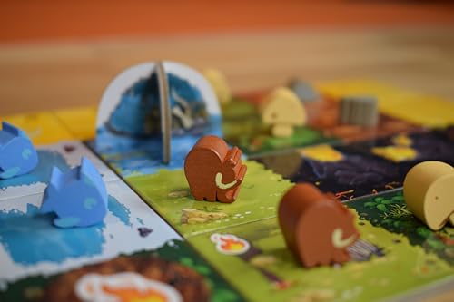 Resource tiles and wooden pieces in Kingdomino Origins for planning