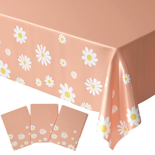 Blue Orchards Daisy Table Cover three-pack on a dining table with daisies.