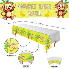 Blue Orchards Monkey Party Tablecovers laid out on a table for a festive setup.