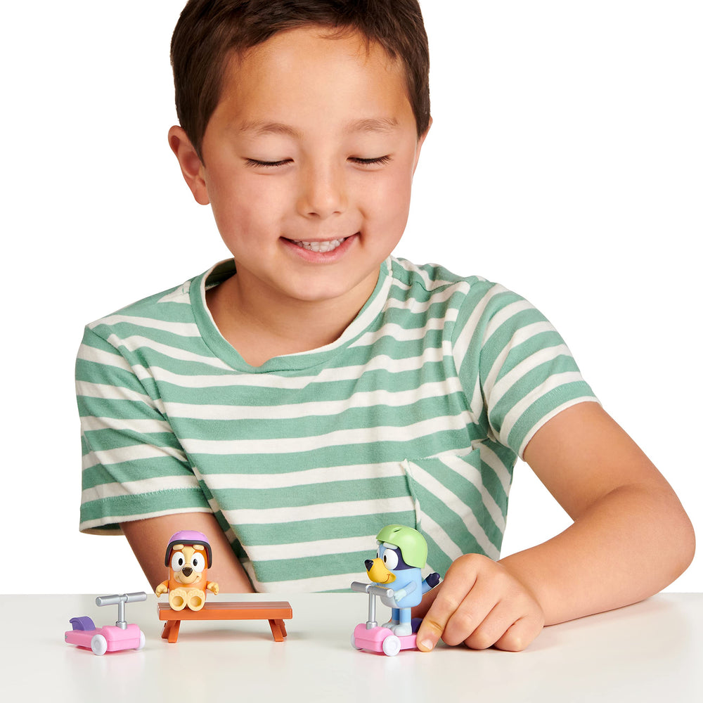 Articulated Bluey and Bingo figures with movable arms for poseable play.