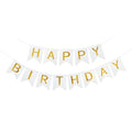 Blukey Happy Birthday banner with gold letters creates a chic photo backdrop.
