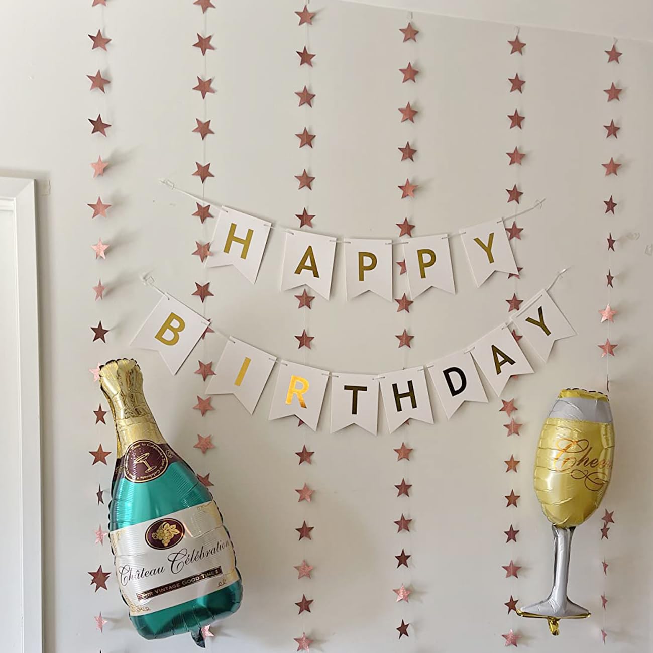 Blukey white banner with gold letters stands out in party photos.