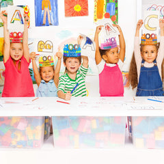 Blulu 100 Days crowns being worn by kids with space to write names.