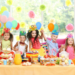 Blulu 100 Days crowns on party table ready for photos.