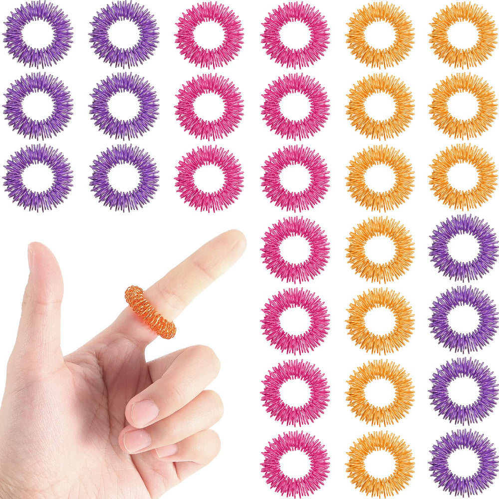 Blulu acupressure rings colorful set on fingers for stress relief and focus.