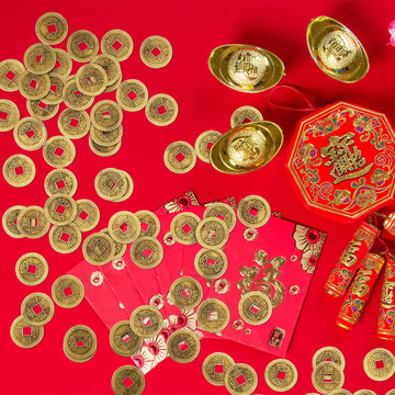 Red string arranged coins for festive charm.