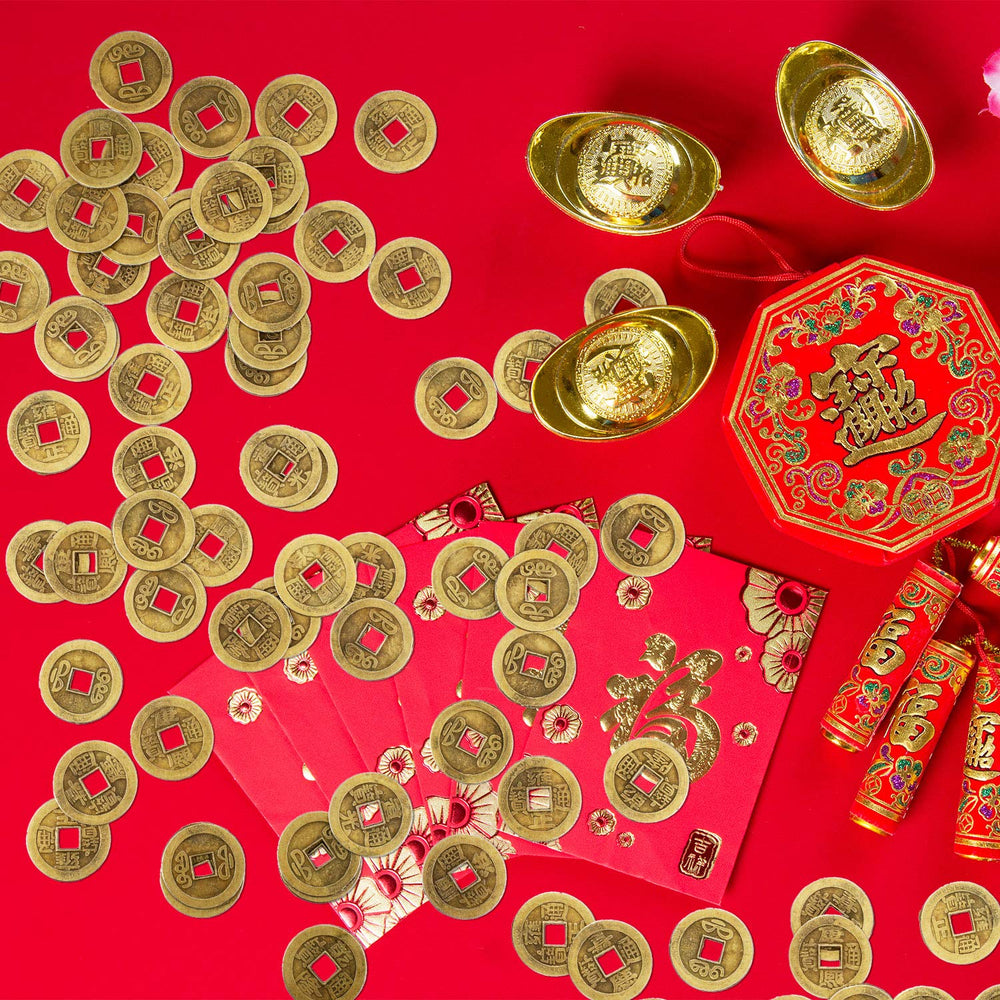 Red string arranged coins for festive charm.