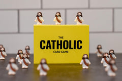 Board Catholic Friends enjoying game night with The Catholic Card Game and smiles.