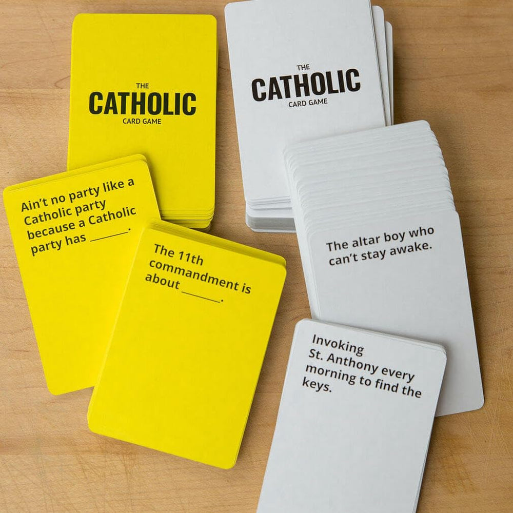 Board Catholic Group laughs and chats while playing The Catholic Card Game.