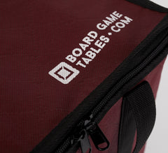 BOARD GAME TABLES.COM red bag with zippered lid protects contents during travel