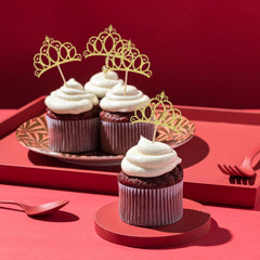 BOHUIZ crowns for birthday cakes enhance a royal party theme.
