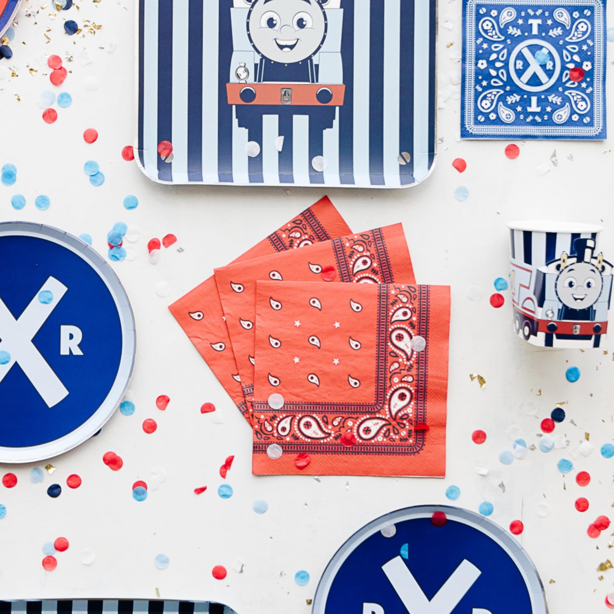 Bonjour Fete napkins close-up red pattern highlighting train theme
