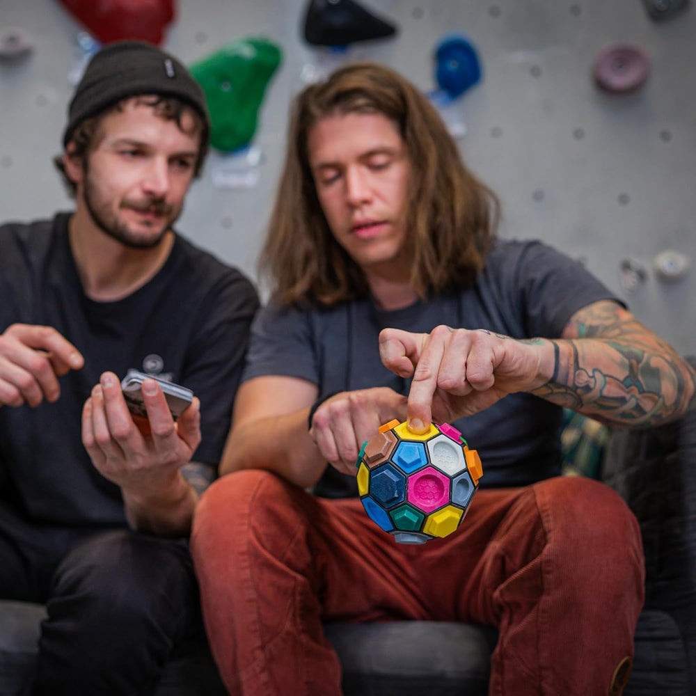 Boulderball in hand demonstrates compact, travel-friendly climbing fun.