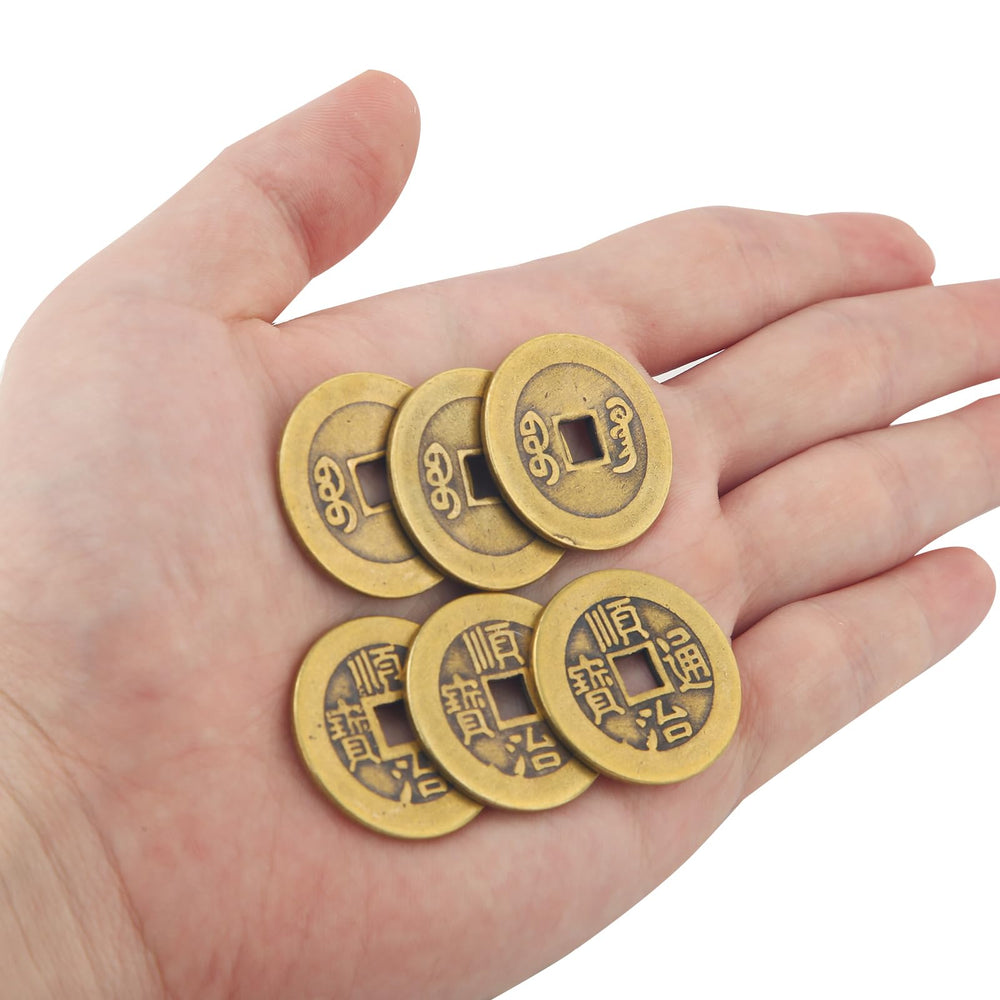 BOXOB coins hanging as a decorative charm for home or office.
