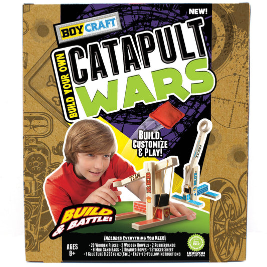 Boy Craft Catapult Wars assemble moment with wood pieces and dowels.