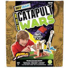 Boy Craft Catapult Wars assemble moment with wood pieces and dowels.