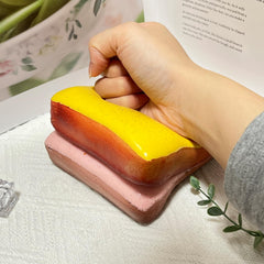 Bread Butter Squishy on a desk demonstrates a lightweight, portable stress relief companion.
