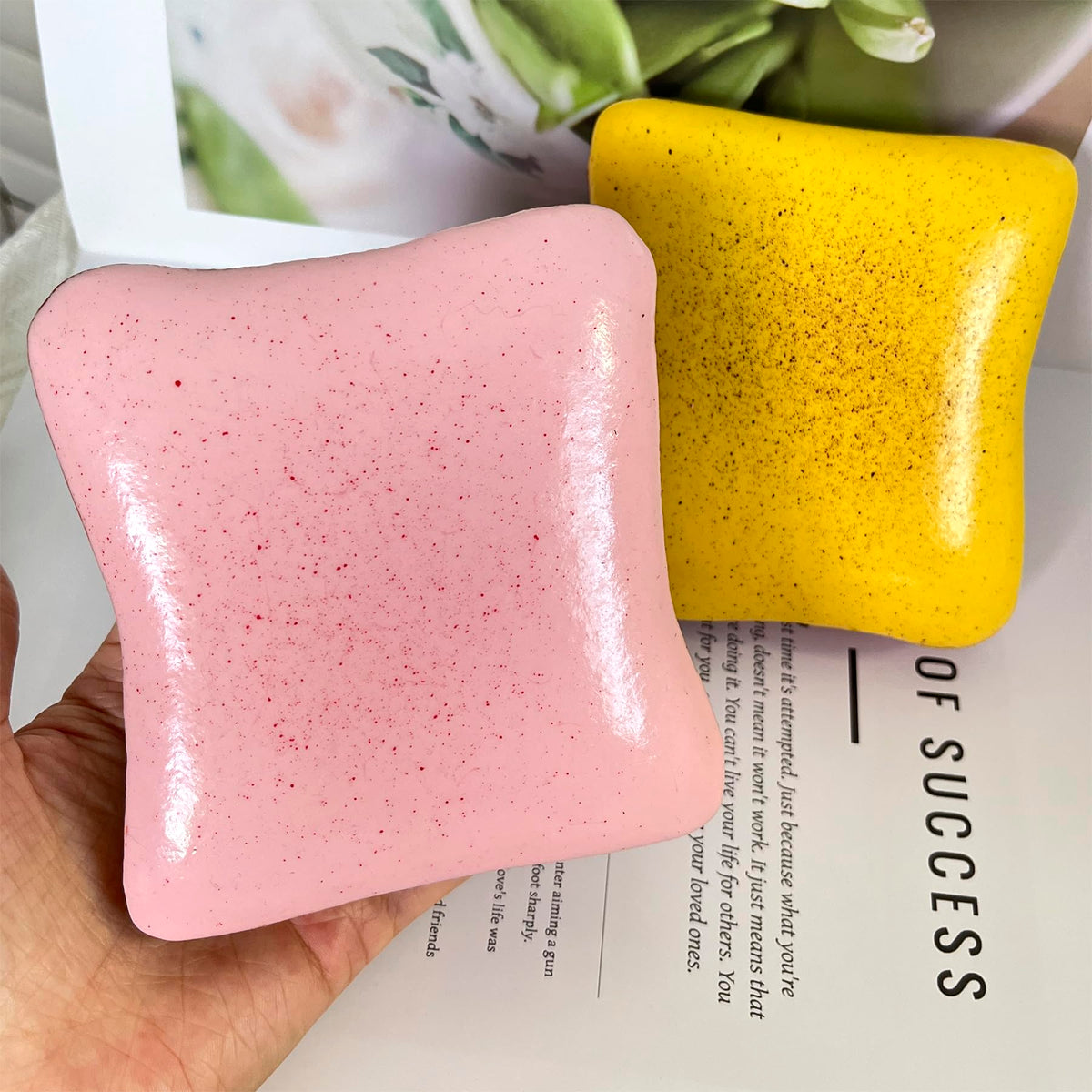 Bread Butter Squishy yellow in hand for tactile stress relief and focus.