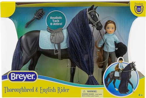 Breyer Charlotte in breeches and helmet ready for grooming and riding adventures.
