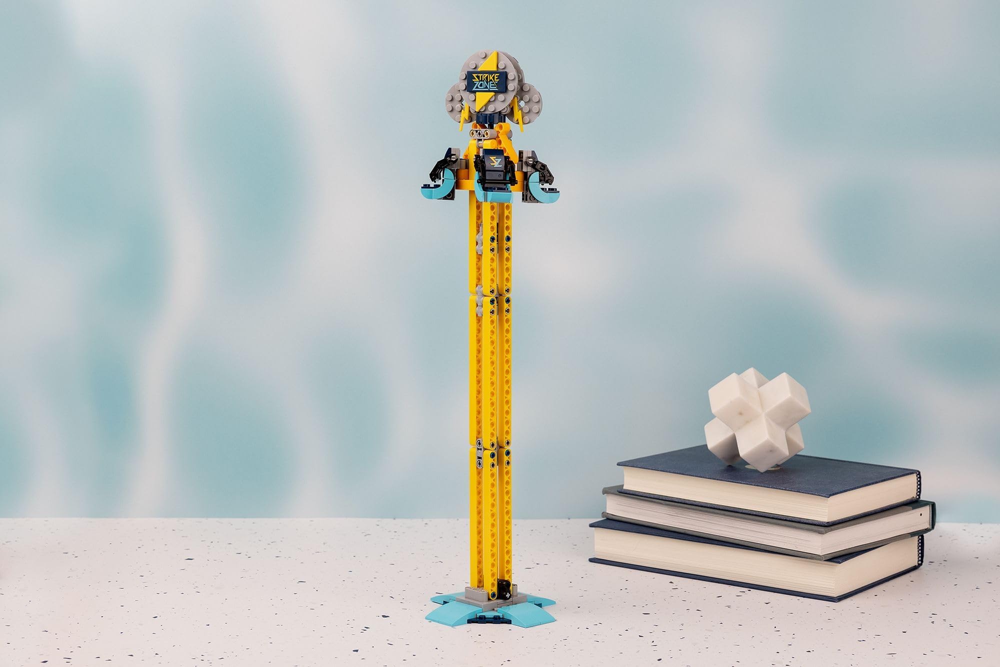 Brick Loot Strike Zone Drop Tower amusement ride image emphasizes interactive play.