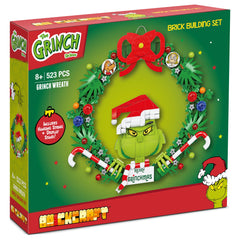 Brickcraft Grinch Wreath with Santa hat adds seasonal flair.