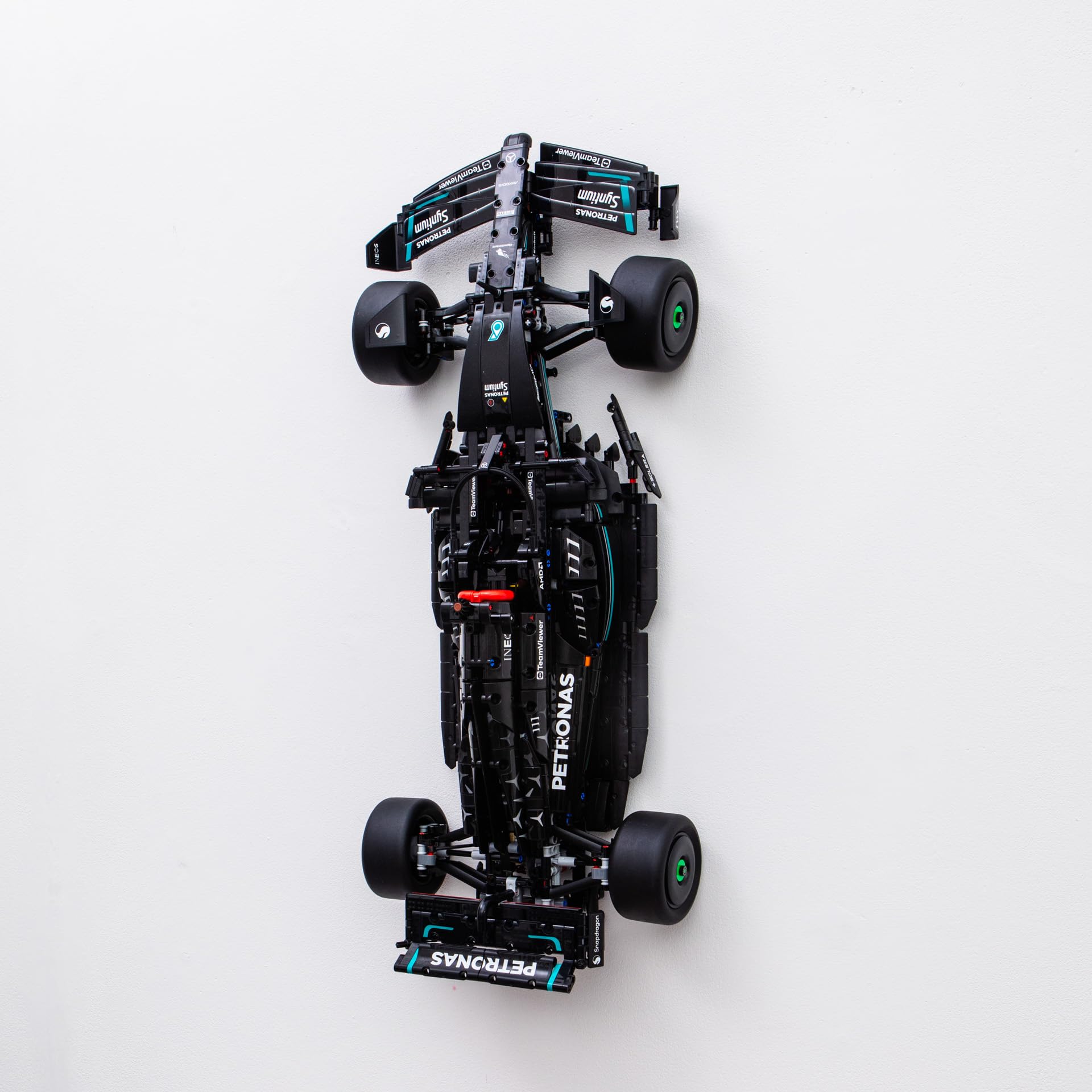 Brickify wall mount securely displays the 42171 Mercedes F1 model on the wall.