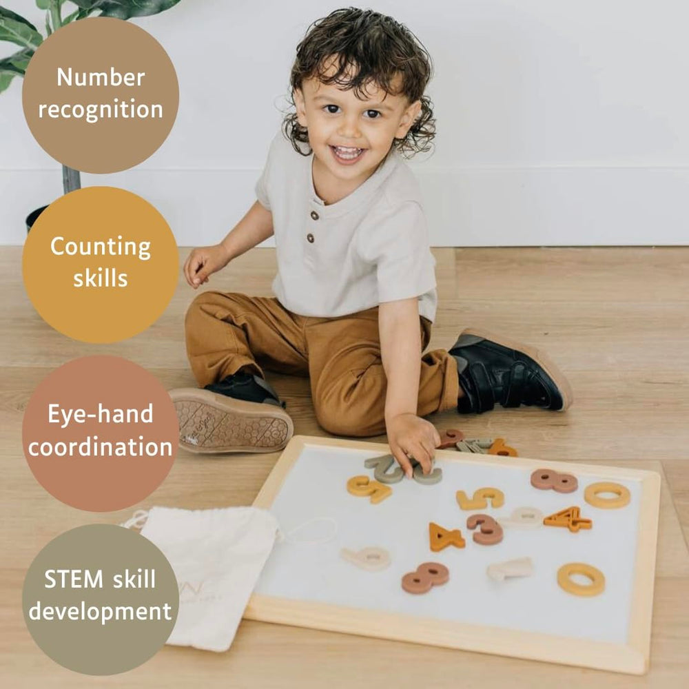 Brooklyn Neutral magnetic numbers in playroom for hands-on number recognition.