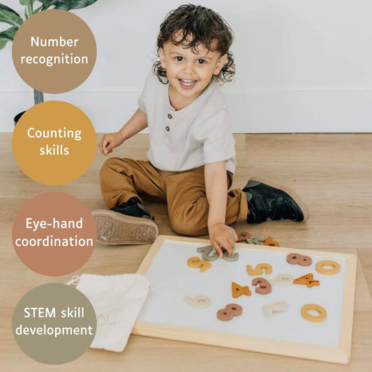 Brooklyn Neutral magnetic numbers in playroom for hands-on number recognition.
