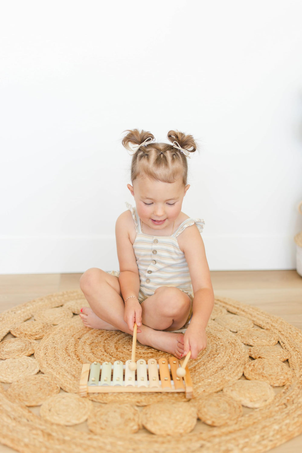 Brooklyn Neutral Xylophone decor and learning toy in a playroom setup.