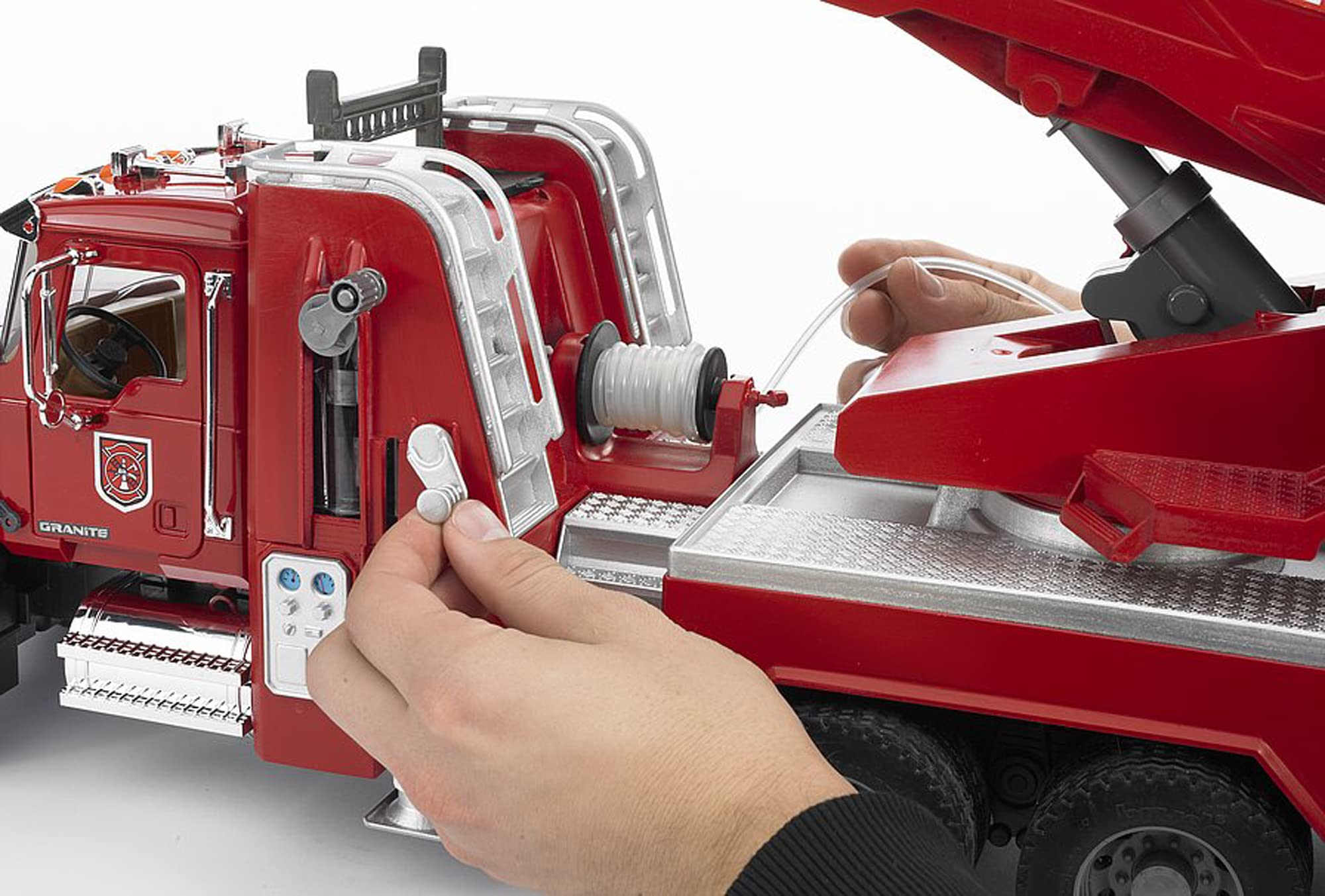 Bruder Mack Granite fire engine integrated water tank enables water action during play.
