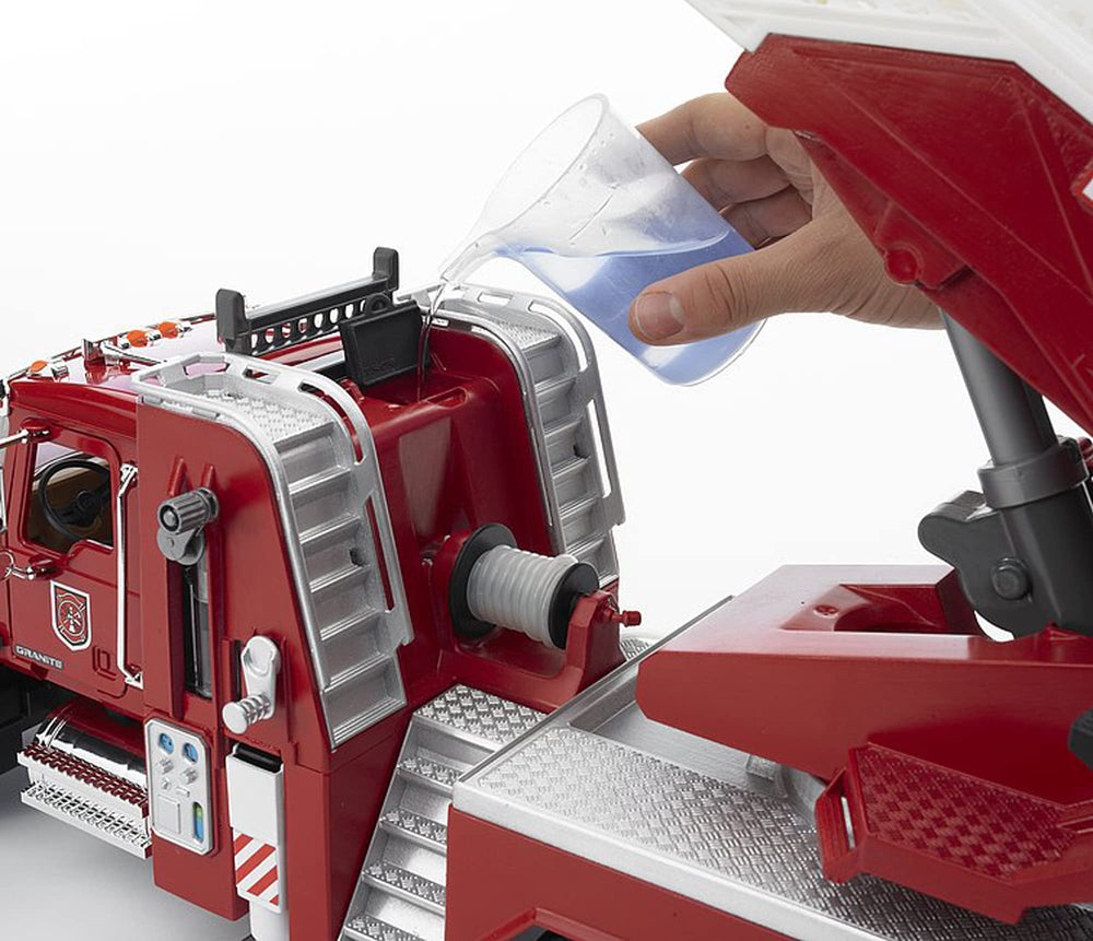 Bruder Mack Granite fire engine opening hood reveals chrome-like detailing.