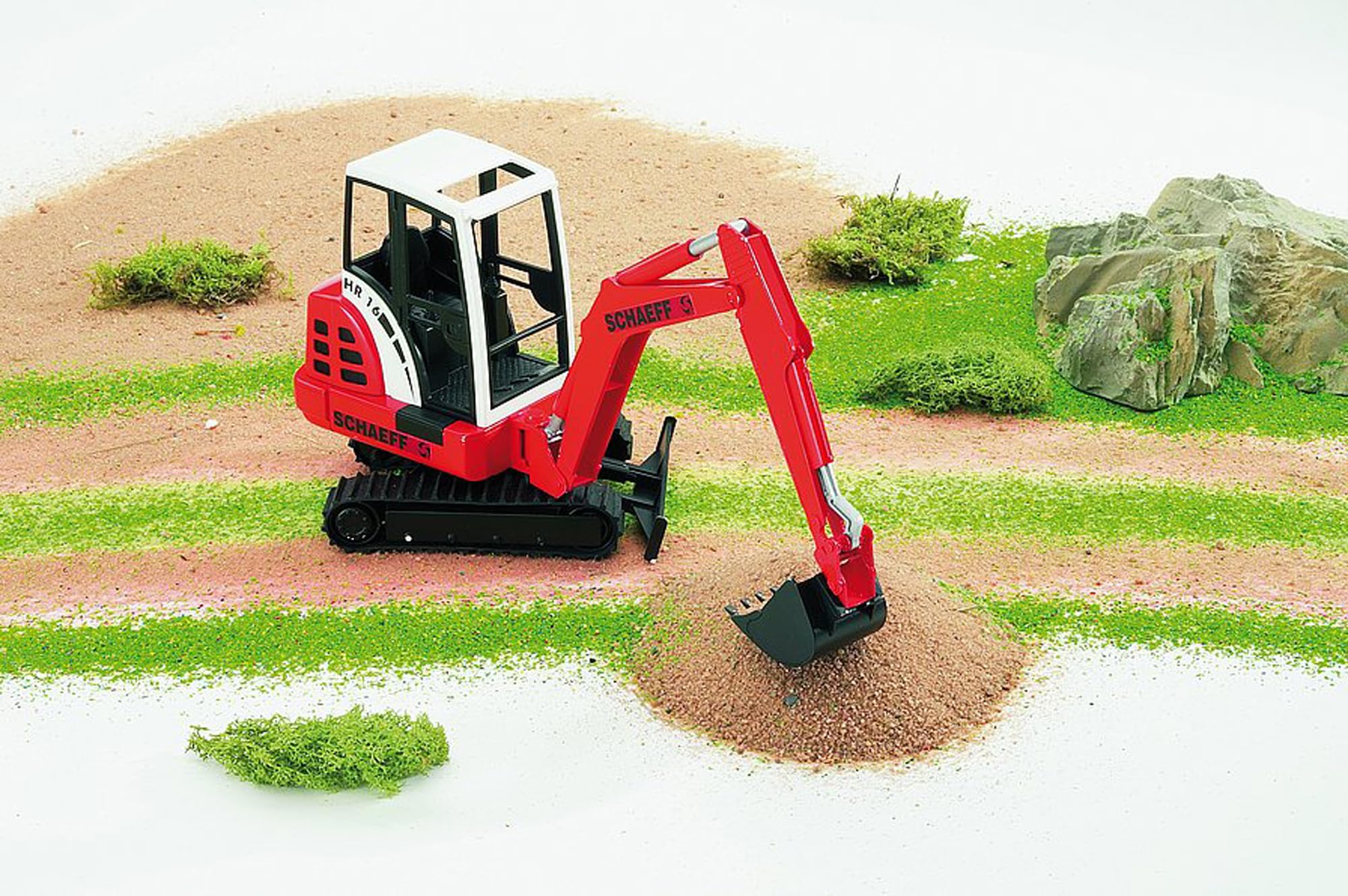 Bruder Schaeff HR 16 mini excavator 360 rotating cab enhances imaginative construction scenes