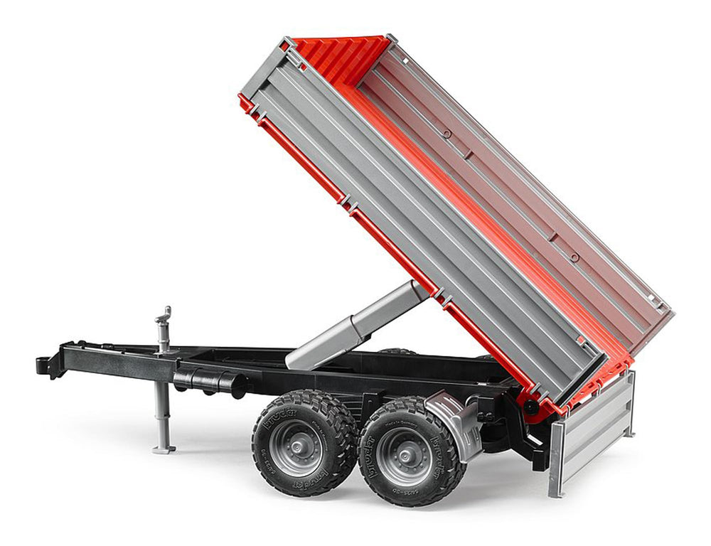 Bruder tipping trailer with tiltable stake body; enables realistic loading play.