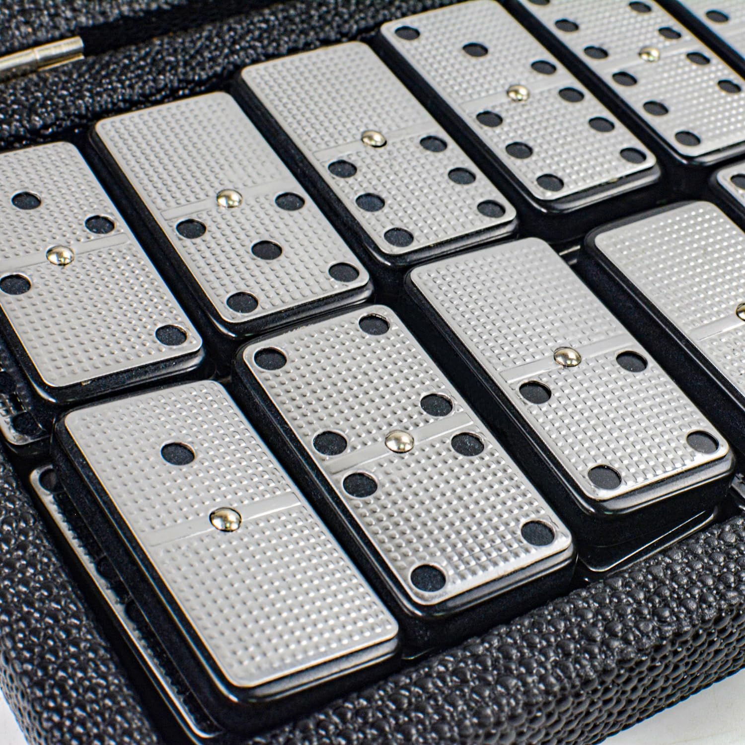 Domino tiles tucked in travel case ready for on-the-go play